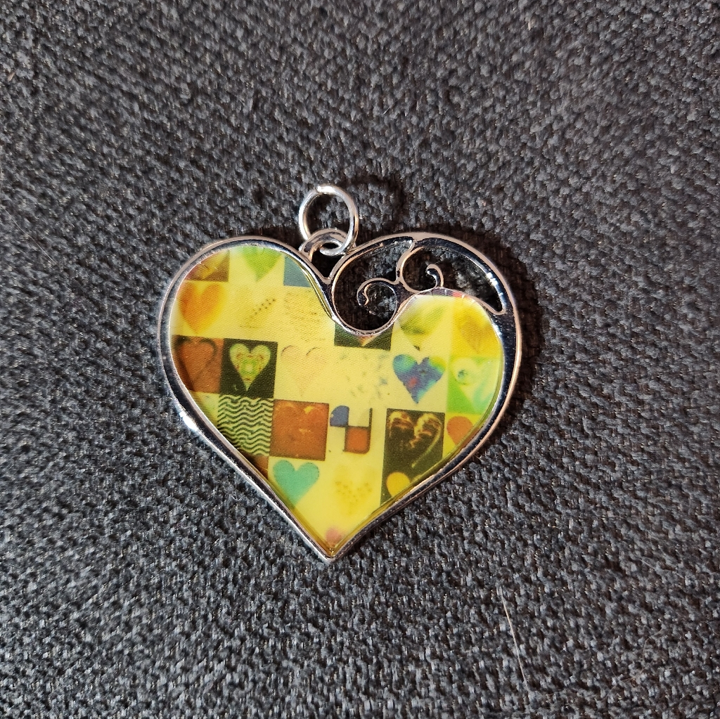 Heart-Shaped Yellow And Silver Pendant 8$